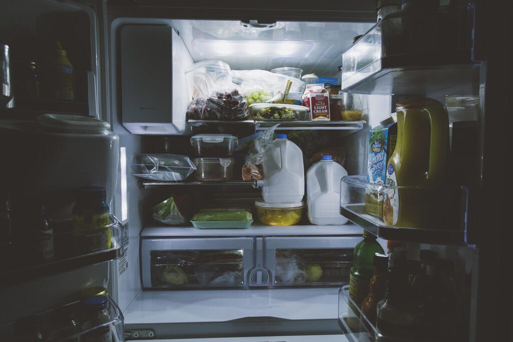 an open fridge showing food inside